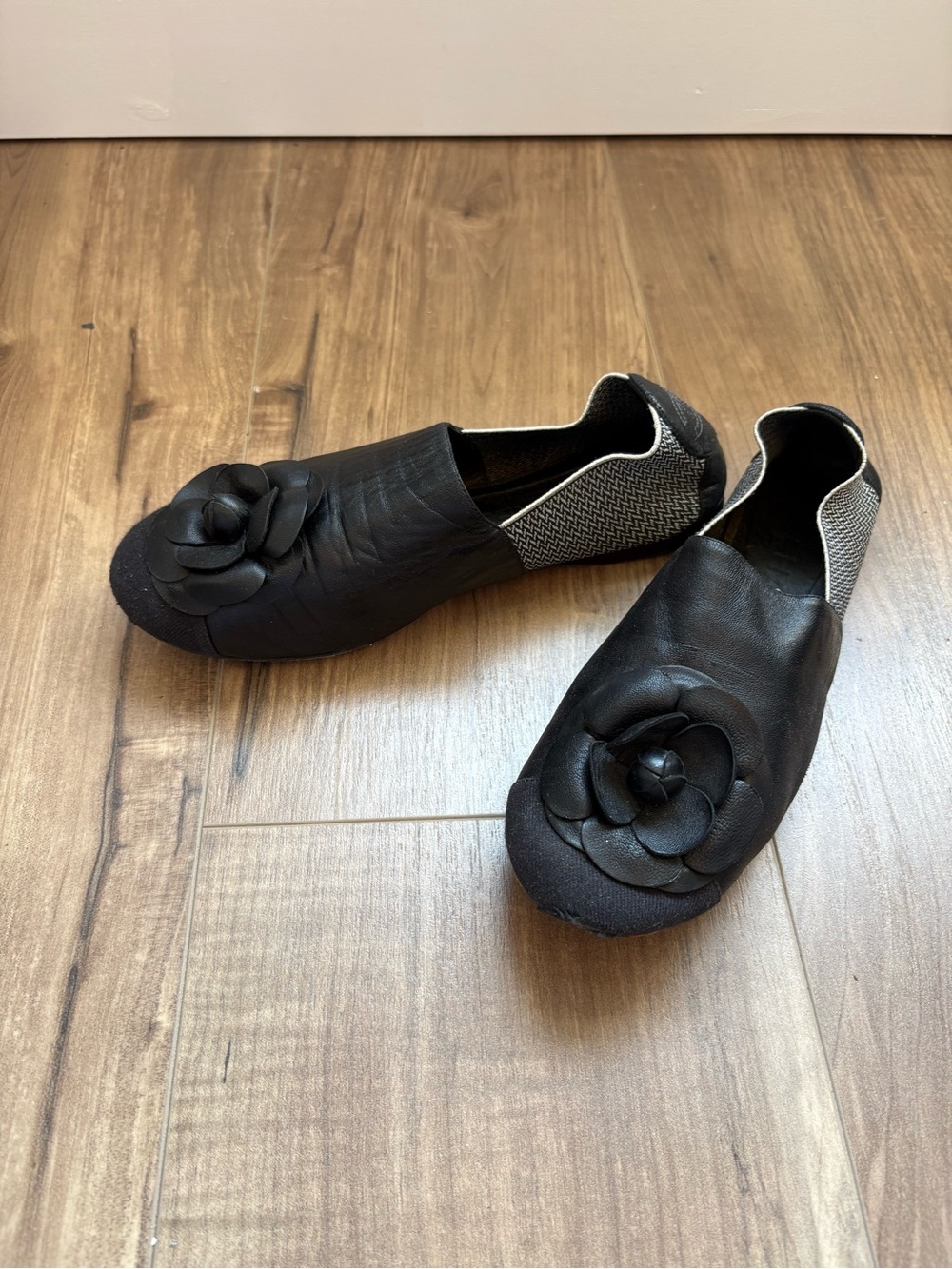 CHANEL Black Leather Camellia Slip-On Flats